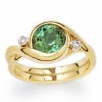 DropboxDONE.Ring_Embrace_GrTourmaline_gold_FS_Finished-Done Embrace - Yellow gold with a green tourmaline and two accent diamonds.
